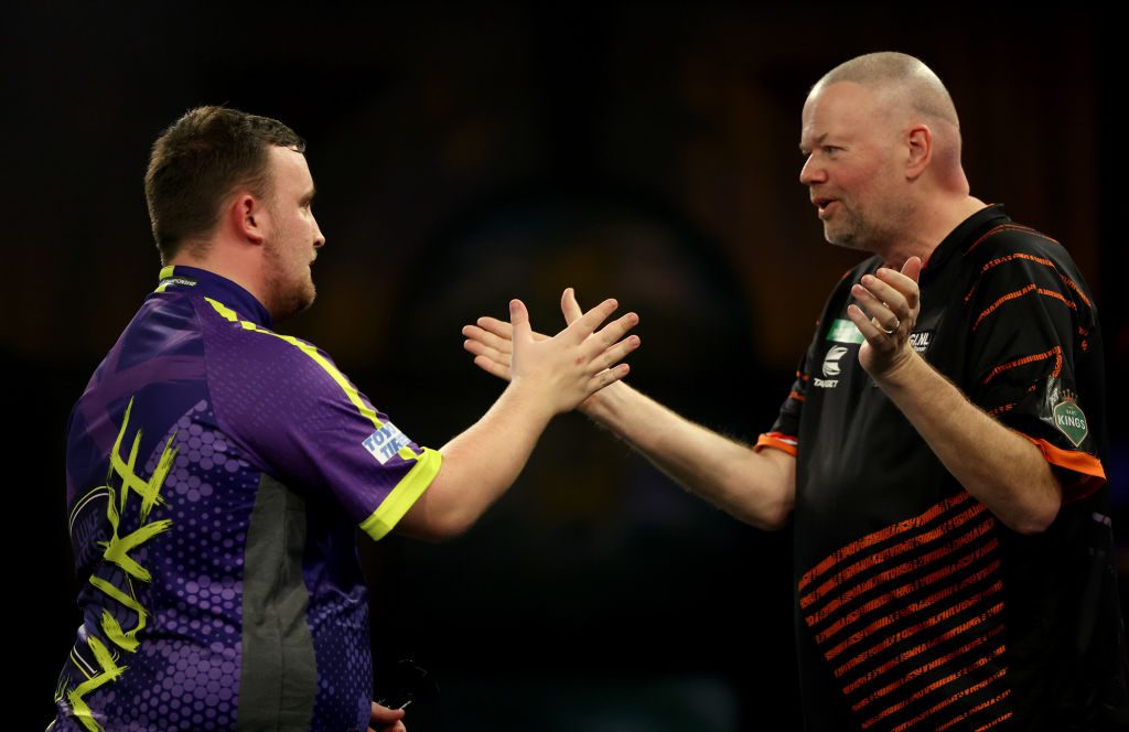 Luke Littler of England celebrates winning his round four match against Raymond van Barneveld of Netherlands on day 13 of the 2023/24 Paddy Power World Darts Championship at Alexandra Palace 