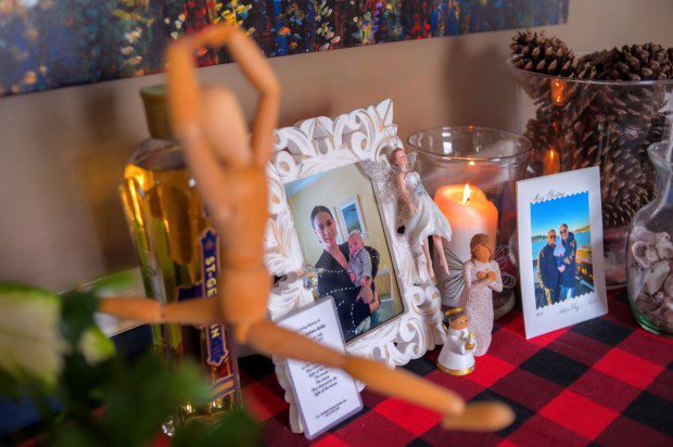 A makeshift memorial in which Kyra Vocci lights a candle daily in remembrance of her sister Andrea Kolbe. (Karl Merton Ferron/Staff)