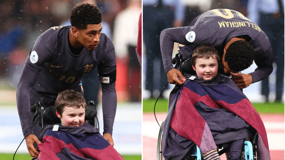 Jude Bellingham places his England jacket over a mascot in a wheelchair (Picture: Getty)