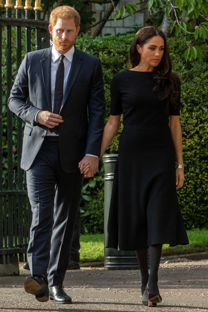 Prince Harry and Meghan, the Duke and Duchess of Sussex, arrive to view floral tributes to Queen Elizabeth II laid outside Cambridge Gate at Windsor Castle on 10th September 2022 in Windsor, United Kingdom. Queen Elizabeth II, the UK's longest-serving monarch, died at Balmoral aged 96 on 8th September 2022 after a reign lasting 70 years. (photo by Mark Kerrison/In Pictures via Getty Images)