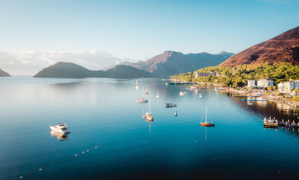 Morning in the bay of Marmaris. Soft dawn. Yachts and boats in the bay of the Mediterranean Sea. Turkish landscape