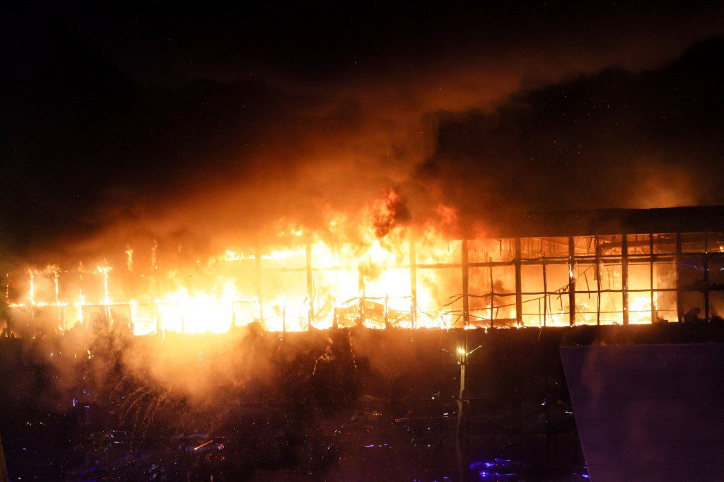 A view shows the burning Crocus City Hall concert hall following the shooting incident in Krasnogorsk