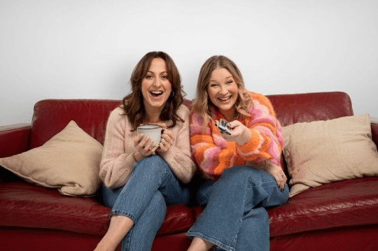 Joanna and Natalie sitting on the sofa