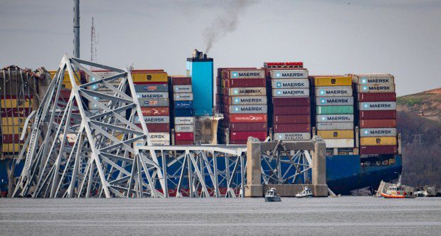 First responders search for victims in the remains of the collapsed Francis Scott Key Bridge. The massive container ship Dali lost power before colliding with one of the bridge's support columns early Tuesday. (Jerry Jackson/Staff)