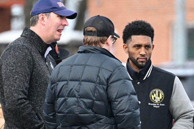 Baltimore mayor Branon Scott, right, talks with Baltimore County Executive Johnny Olszewski, Jr., after a news conference about the collapse of the Francis Scott Key Bridge after it was hit by a ship early Tuesday morning. (Jerry Jackson/Staff)