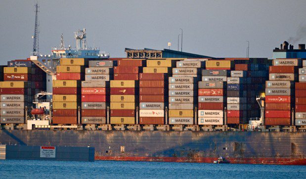 A remaining ramp of the Key Bridge is seen beyond the Dali container ship after the bridge collapsed this morning after the ship hit the bridge. (Jerry Jackson/Staff)