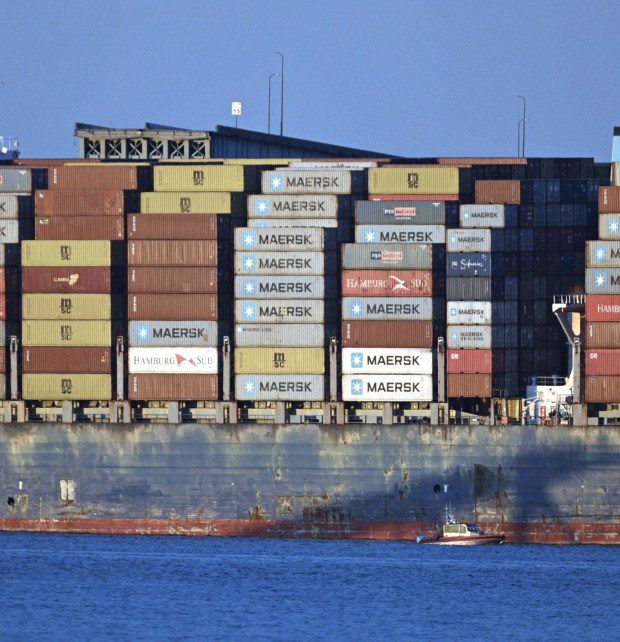 A remaining ramp of the Key Bridge is seen beyond the Dali container ship after the bridge collapsed this morning after the ship hit the bridge. (Jerry Jackson/Staff)