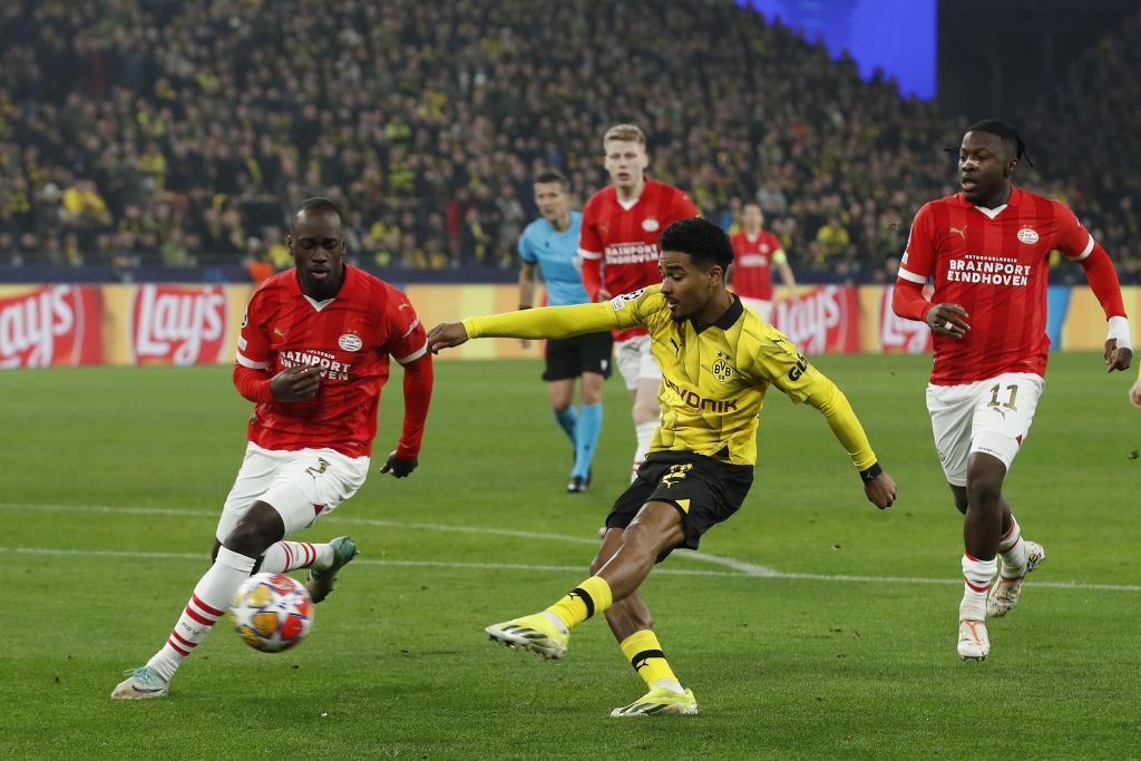 Jordan Teze of PSV Eindhoven, Ian Maatsen of Borussia Dortmund, Johan Bakayoko of PSV Eindhoven during the UEFA Champions League last 16 match between Borussia Dortmund and PSV Eindhoven at Signal Iduna Park