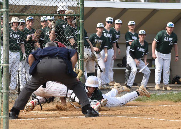 Pennridge's Matt Atchley, 22, is out at home plate as he is tagged by Souderton catcher Connor Klock, 2, during the top of the first inning of their game on Tuesday, March 26, 2024. (Mike Cabrey/MediaNews Group)