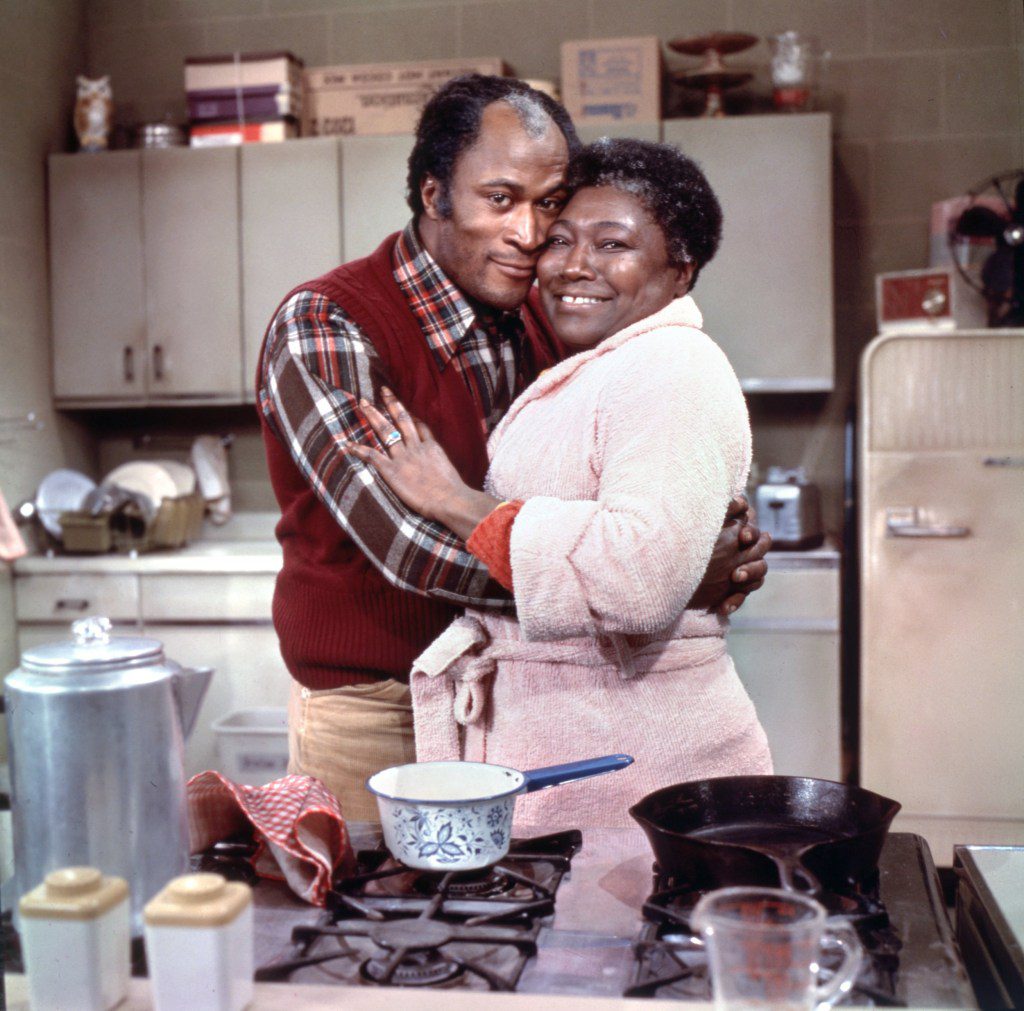 LOS ANGELES - JANUARY 1: Pictured from left is John Amos (as James Evans, Sr.), Esther Rolle (as Florida Evans) in the CBS television situation comedy, GOOD TIMES. January 1, 1977. (Photo by CBS via Getty Images)