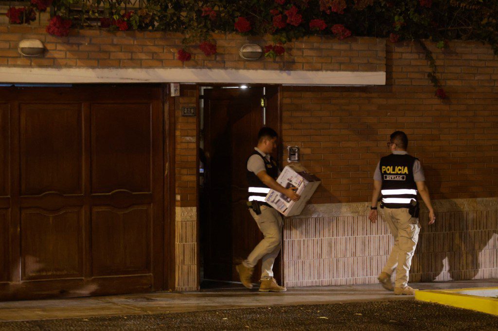 Police leave President Dina Boluarte's house during a raid ordered by the Attorney General's Office as part of a preliminary investigation in Lima on March 30, 2024. Peruvian authorities raided President Dina Boluarte's home on March 30 as part of an ongoing corruption investigation related to undisclosed luxury watches. (Photo by Juan Carlos CISNEROS / AFP) (Photo by JUAN CARLOS CISNEROS/AFP via Getty Images)