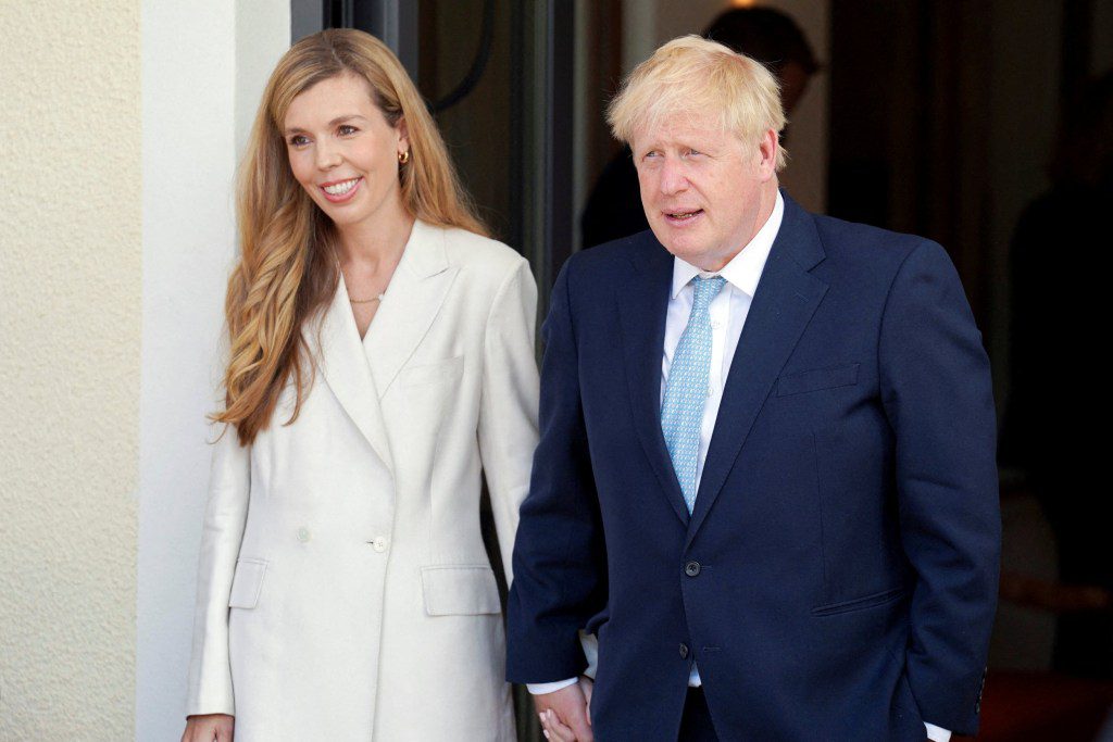 FILE PHOTO: British Prime Minister Boris Johnson and wife Carrie arrive for the official welcome ceremony during the G7 summit in Schloss Elmau, near Garmisch-Partenkirchen, Germany June 26, 2022. Stefan Rousseau/Pool via REUTERS/File Photo