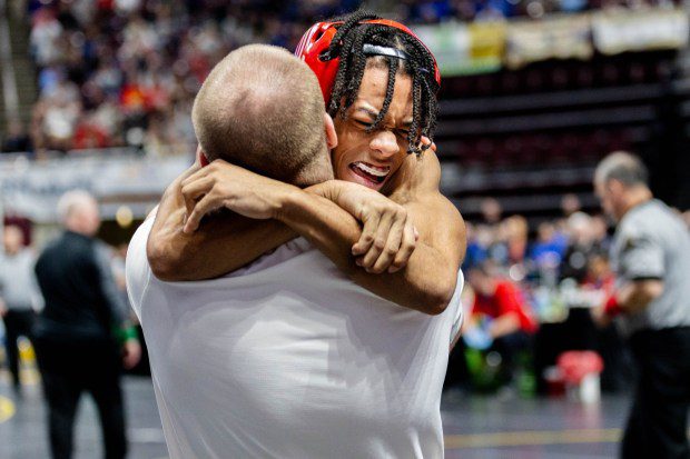 Ridley's Curtis Nelson gets a hug after his last-second win in the 114-pound semifinals. (Nate Heckenberger - For MediaNews Group)