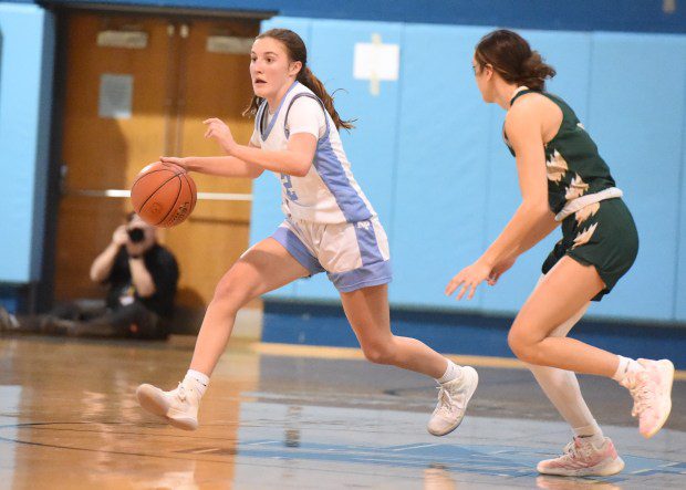 North Penn's Cameron Crowley, 2, drives up the court as Emmaus' Gabby DeVita, 4, defends during their PIAA-6A first round game on  Friday, March 8, 2024. (Mike Cabrey/MediaNews Group)