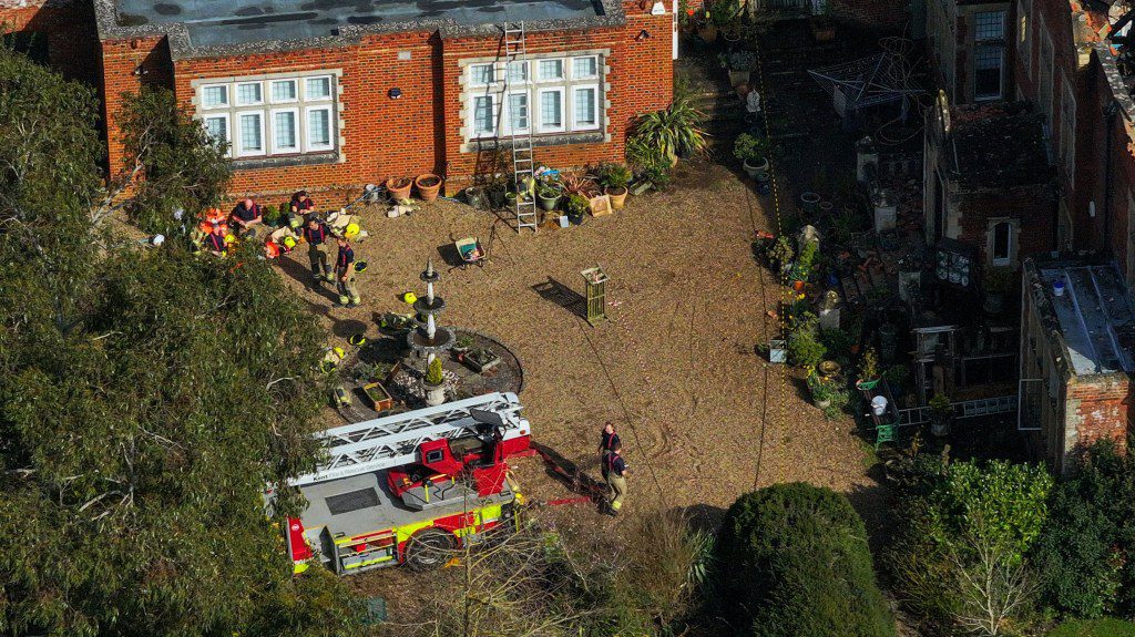 A devastating fire has engulfed Gennings Park, a historic house in Hunton, Kent, believed to be the inspiration for Jane Austen's iconic novel, Pride and Prejudice. The fire, which broke out on Friday evening around 21:00 has left the building in ruins, with the roof collapsing under the intense blaze. Gennings Park, dating back to the first half of the 18th century, holds a significant place in literary history, with Historic England suggesting it as the possible setting for Austen's renowned work. The loss of this architectural gem is not only a blow to the local community but also to literary enthusiasts worldwide. Kent Fire & Rescue Service responded swiftly to the emergency, dispatching 16 fire engines and approximately 50 firefighters to battle the inferno. The fire was concentrated on the first floor and in the roof space of the property, presenting challenging conditions for the firefighters. Despite their valiant efforts, the flames proved relentless, ultimately leading to the partial collapse of the building. A technical rescue team was deployed to assist in salvaging belongings from the property, highlighting the desperate attempts to preserve what remained of the historic structure. Andrew Lawrence, the owner of Gennings Park, recounted the harrowing experience of witnessing his beloved property consumed by flames. Lawrence was inside the house when the fire alarm sounded, initially dismissing it as a false alarm. However, upon stepping outside, he was met with a horrifying sight of flames bursting through the roof. Describing the house as 