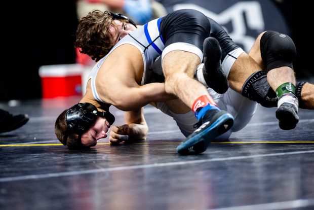 Quakertown's Mason Ziegler locks up a cradle against West Scranton's Tyson Cook in a 3-1 win in the 121-pound consolation final. (Nate Heckenberger - For MediaNews Group)