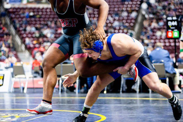 Kennett's John Pardo gets in on a shot against St. Joe's Prep's Maxwell Roy in a 6-2 win in the 285-pound fifth-place bout.  (Nate Heckenberger - For MediaNews Group)