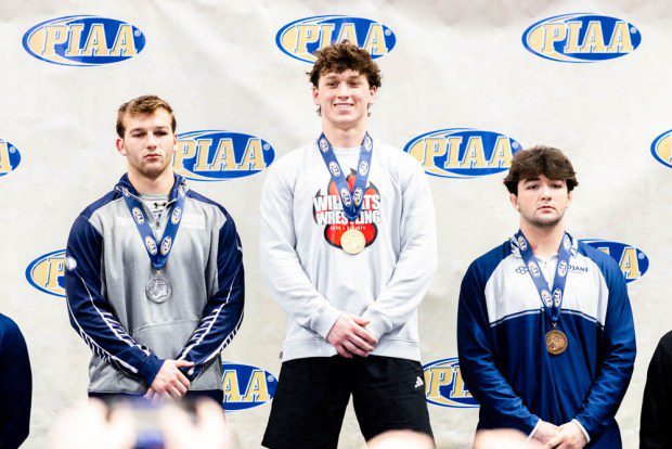 Owen J. Roberts' Dillon Bechtold smiles on top of the podium after winning the Class 3A 215-pound final. (Nate Heckenberger - For MediaNews Group)