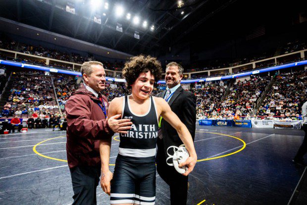 Faith Christian's Joey Bachmann celebrates after winning the Class 2A 107-pound state championship. (Nate Heckenberger - For MediaNews Group)