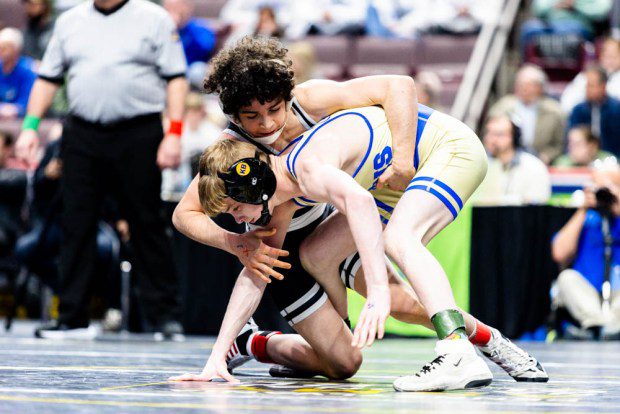 Faith Christian's Joey Bachmann works on top of Chestnut Ridge's Dom Deputy in the 107-pound 2A final. (Nate Heckenberger - For MediaNews Group)