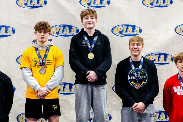 Faith Christian Academy's Adam Waters stands atop the podium after winning the Class 2A 172-pound final. (Nate Heckenberger - For MediaNews Group)