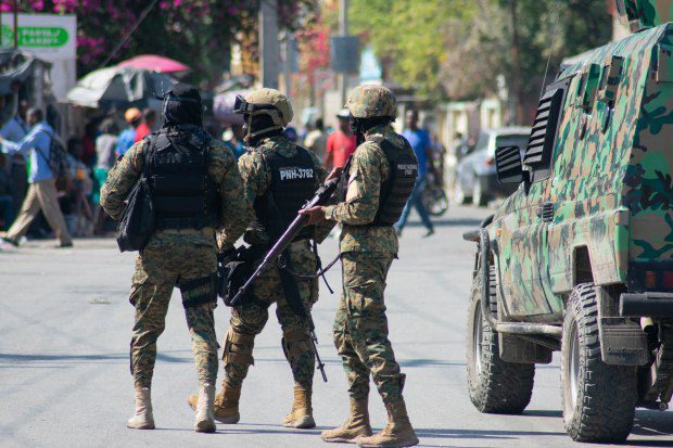 Haitian police officers deploy in Port-au-Prince, Haiti, on Saturday. (Photo by Clarens Sifroy / AFP via Getty Images)