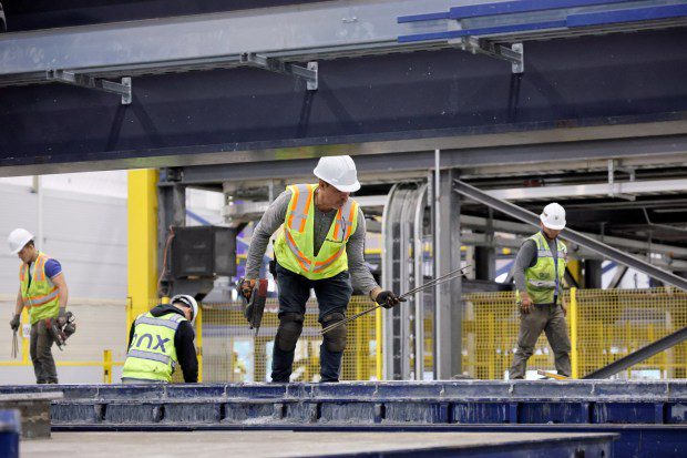 Workers lay steel rebar inside of wall forms at Onx's Pompano Beach factory on Thursday, April 4, 2024. The company says its prefabricated homes can withstand 175 MPH winds. (Amy Beth Bennett / South Florida Sun Sentinel)