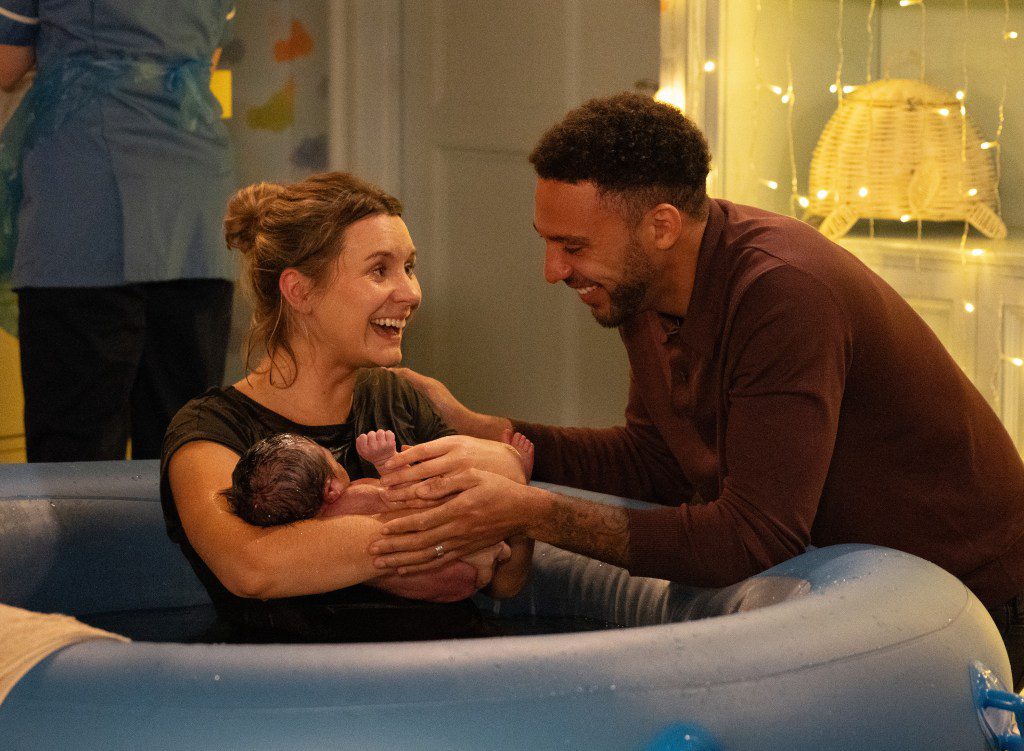 Dawn and Billy hold baby Evan in the birthing pool in Emmerdale