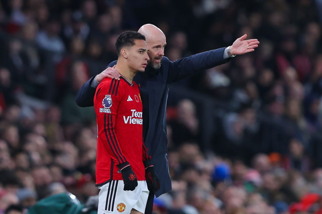 Antony pictured getting instructions from Erik ten Hag in a match against Luton