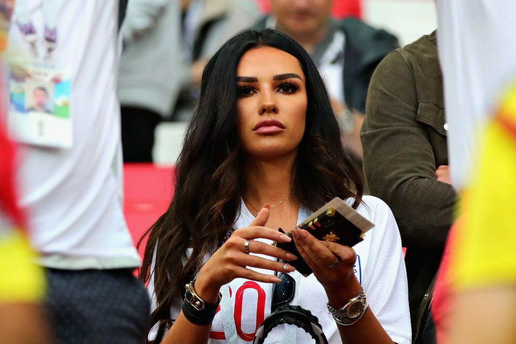 Ruby Mae sat in the stands at a football match.