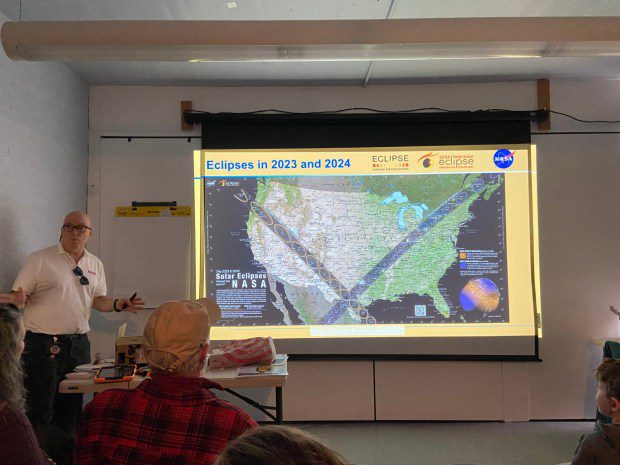 Donald R. Miller, a NASA Solar System Ambassador, uses a map to explain the path the total solar eclipse will take across North America on April 8 during a program Tuesday at the Pottstown Regional Public Library. (Evan Brandt -- MediaNews Group)