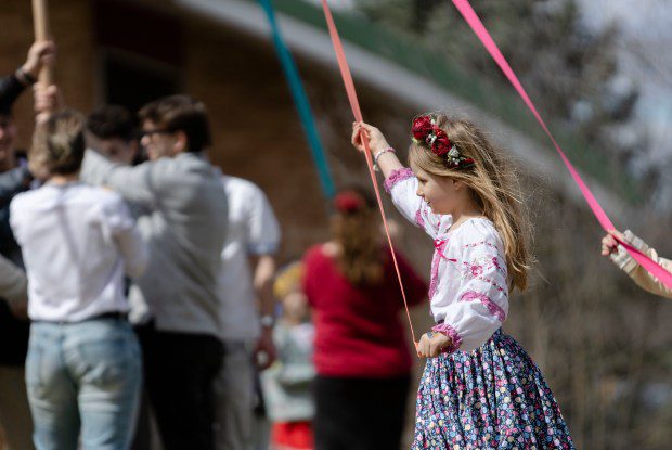 Melanie Popova circles a maypole during the Ukrainian Easter celebration at Christ the King Ukrainian Catholic Church in Jamaica Plain. (Libby O'Neill/Boston Herald)