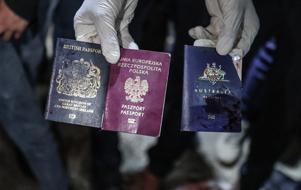 DEIR AL BALAH, GAZA - APRIL 01: (EDITORS NOTE: Image depicts death) Passports of the officials working at the US-based international volunteer aid organization World Central Kitchen (WCK), who are killed, are seen after an Israeli attack on a vehicle belonging to WCK in Deir Al-Balah of Gaza on April 01, 2024. (Photo by Ali Jadallah/Anadolu via Getty Images)