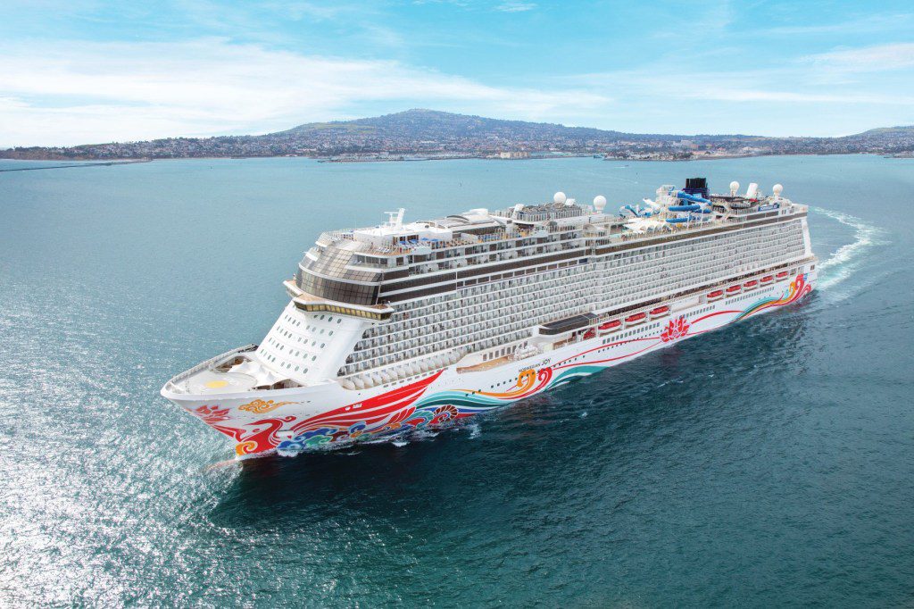 The Norwegian Dawn cruise ship traveling on the sea.