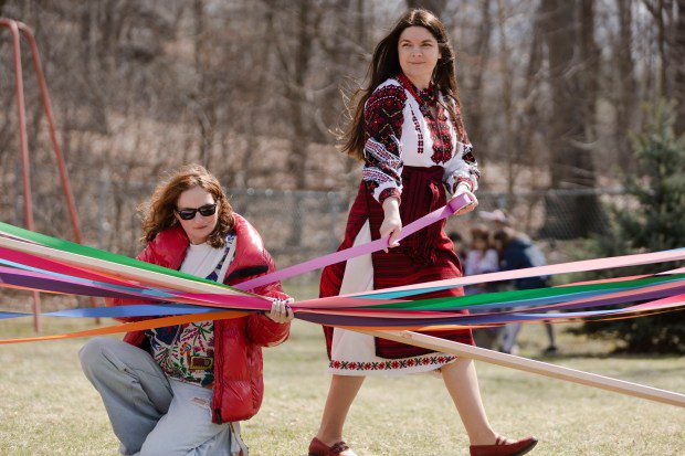 Nadia Mashtalir (left), from Brookline, and Lana Tsar, from Malden, add ribbon to the maypole during the Ukrainian Easter celebration at Christ the King Ukrainian Catholic Church in Jamaica Plain. (Libby O'Neill/Boston Herald)