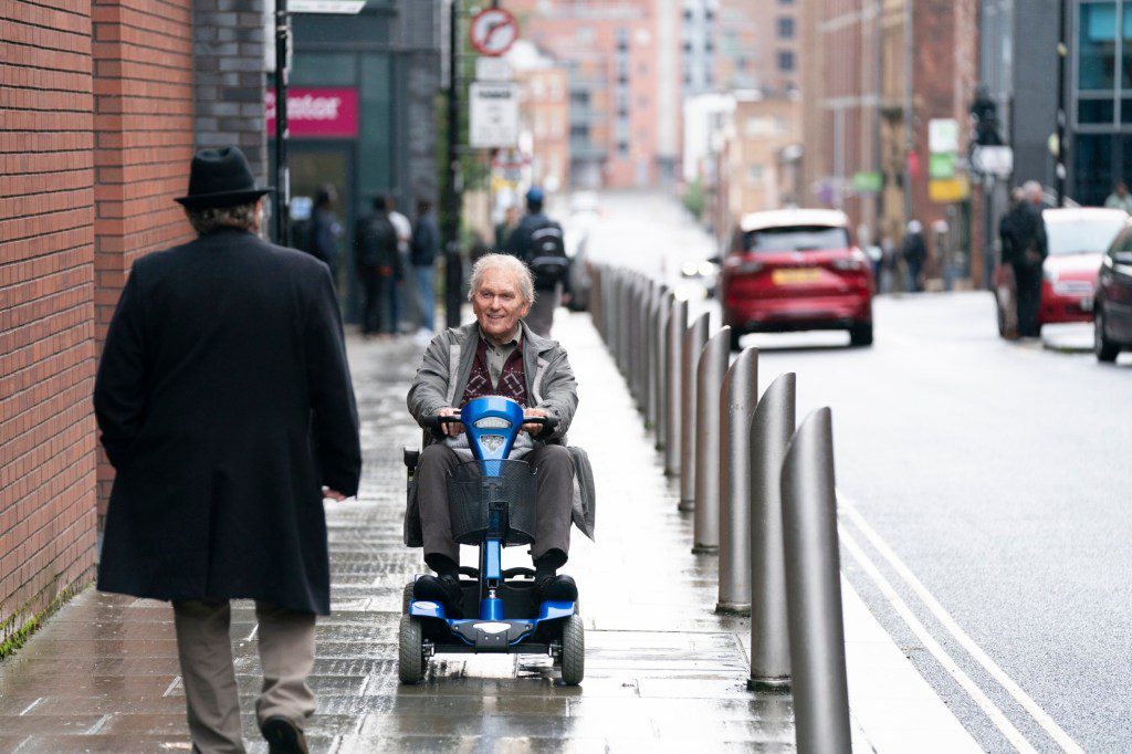 Jon Richardson on a mobility scooter