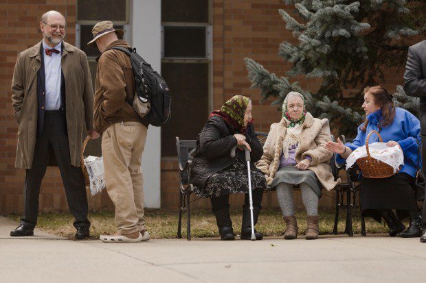 People gather outside of Christ the King Ukrainian Catholic Church in Jamaica Plain during Sunday's Easter celebration. (Libby O'Neill/Boston Herald)