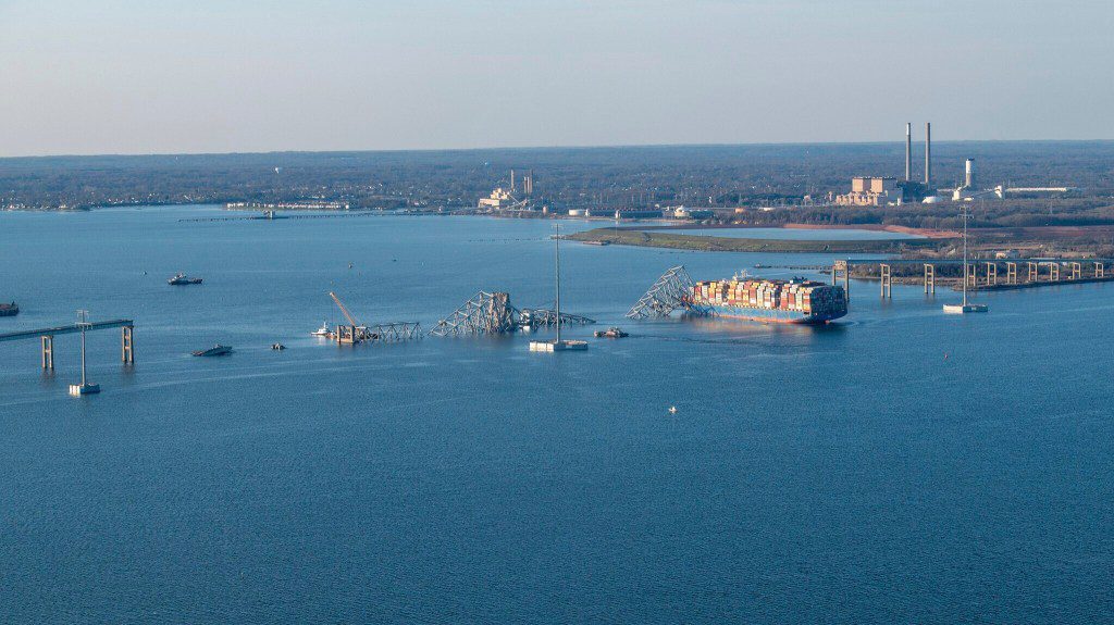 In this photo provided by the U.S. Coast Guard, the M/V Dali is shown with the collapsed Francis Scott Key Bridge, Saturday, March 30, 2024, in Baltimore. The Key Bridge Response Unified Command priorities are ensuring the safety of the public and first responders, accountability of missing persons, safely restoring transportation infrastructure and commerce, protecting the environment and supporting the investigation. (Petty Officer 3rd Class Kimberly Reaves/U.S. Coast Guard via AP)