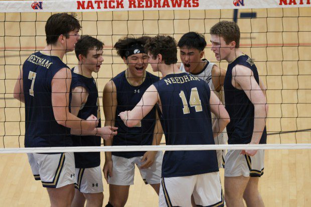 Needham players react to a point scored at Natick on Thursday night. Needham won a hard-fought battle, 3-1. (Photo by Reba Saldanha/Boston Herald)