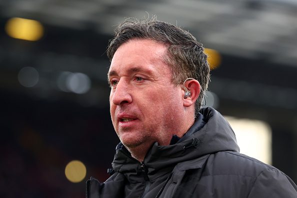 Liverpool legend Robbie Fowler looks on