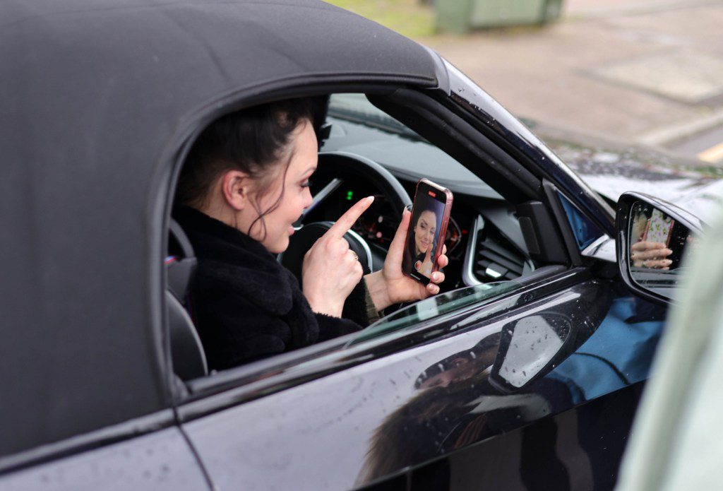 Shona McGarty recording a video message on an EastEnders fan's phone