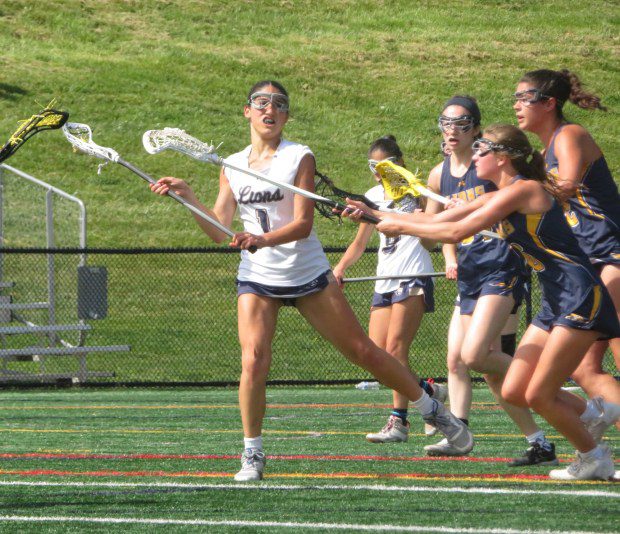 Lower Moreland's Roya Rosala looks to pass against New Hope-Solebury Wednesday, May 8, 2024. (Ed Morlock/MediaNews Group)